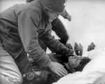 Chaplain O'Callahan giving the last rights to a sailor. The sailor actually survived.