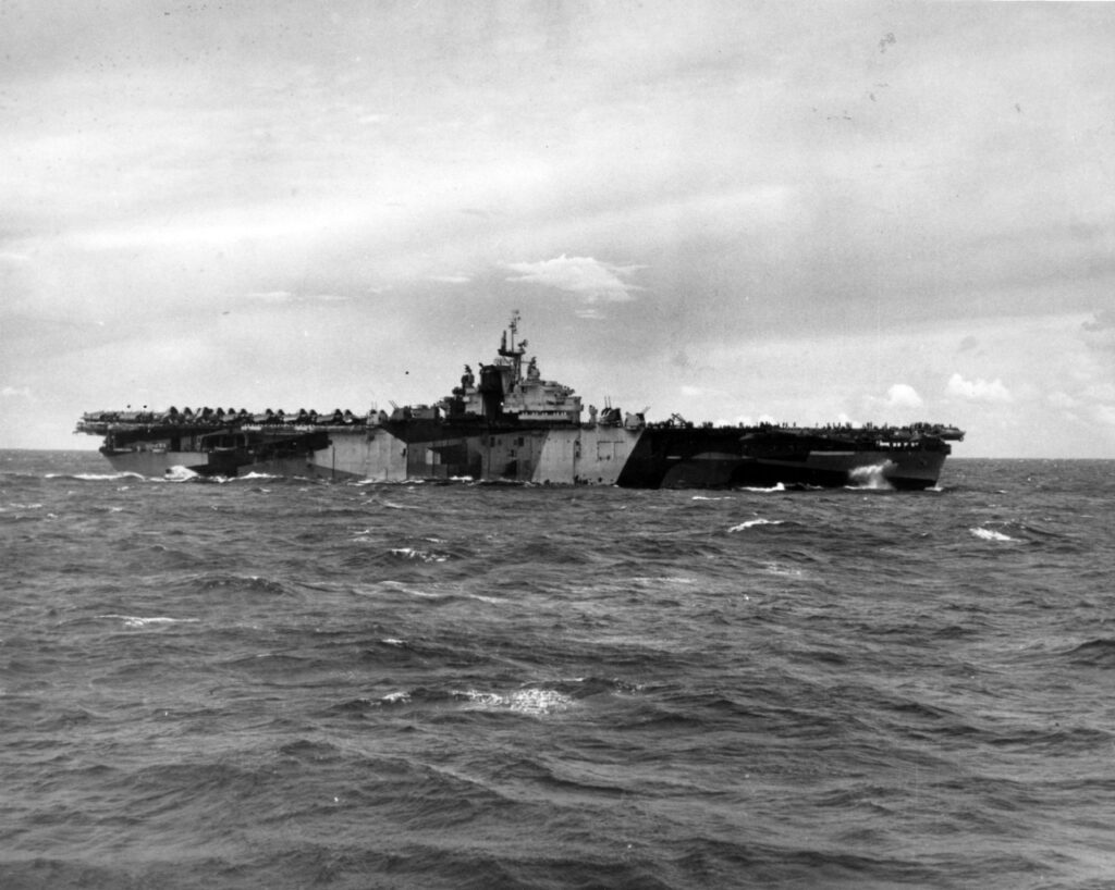 Operating near the Marianas, 1 August 1944. Photographed from USS Hornet (CV-12). Franklin is painted in camouflage Measure 32, Design 6a. At this time, Design 6a was applied only to her starboard side. She wore Design 3a on the port side. Official U.S. Navy Photograph, now in the collections of the National Archives. Catalog #: 80-G-367248