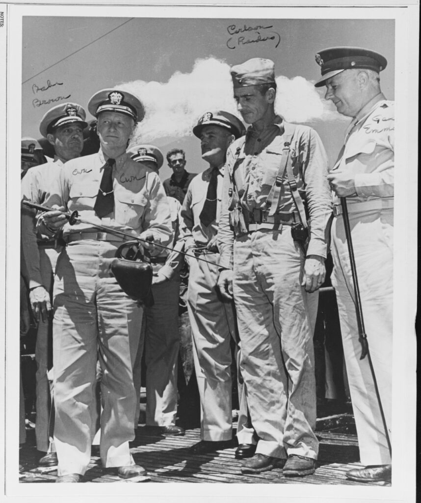 Admiral Nimitz visiting Guadalcanal shown holding a Samurai sword. The US Navy's ability to provide logistics was a key reason why the Japanese were defeated there.