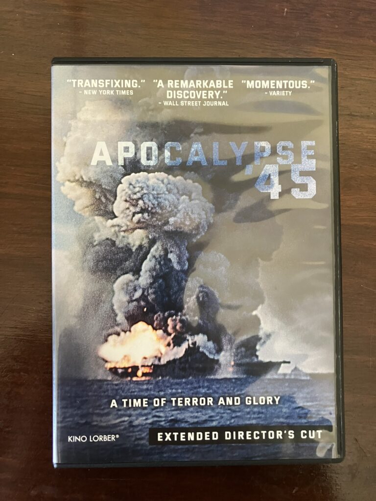 The DVD Cover of Apocalypse '45 showing USS Franklin wracked by tremendous explosions and towering clouds of smoke and flame