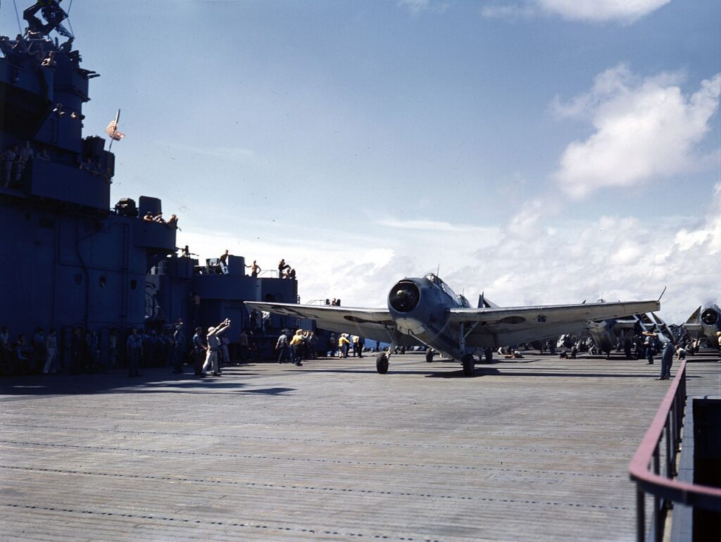 Grumman TBF Avenger awaits single from plane captain to take off from a US Carrier during WWII. U.S. Navy photo 80-G-K-15278