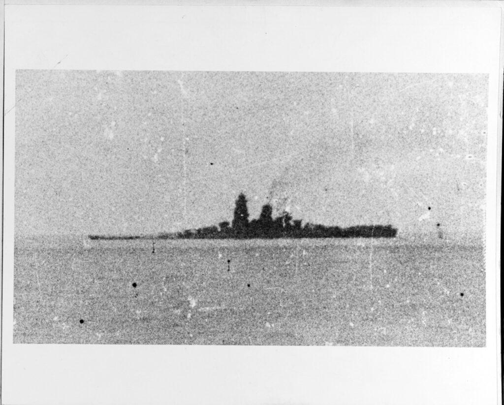 The Japanese battleship Musashi down at the bow after being hit by U.S. Navy carrier plane attacks in the Sibuyan Sea. Courtesy of Lieutenant Tobei Shiraishi. U.S. Naval History and Heritage Command Photograph. Catalog #: NH 63434