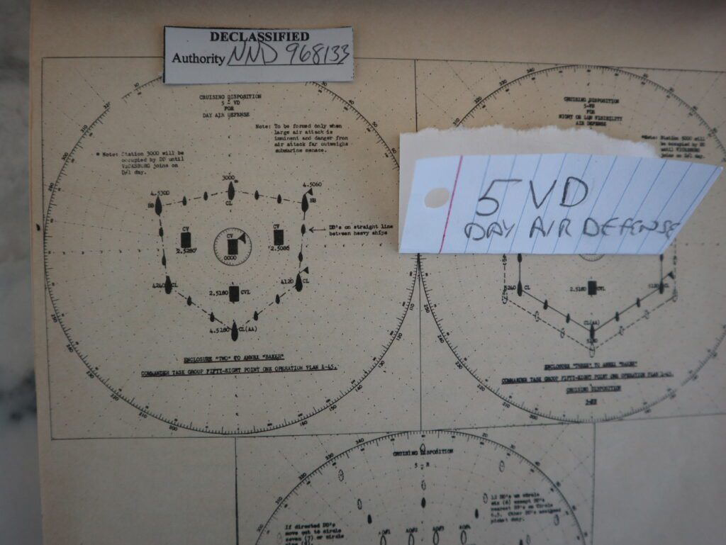 Ship formation used during daylight of Task Force 58. In a round circle the carrier flag ship is at the center. To its port and starboard are two other carriers, with a light carrier behind it. Surrounding them are battleships, cruisers and destroyers. This formation, called 5-VD, is used when the probability of air attack is high and that of submarine attack is low.