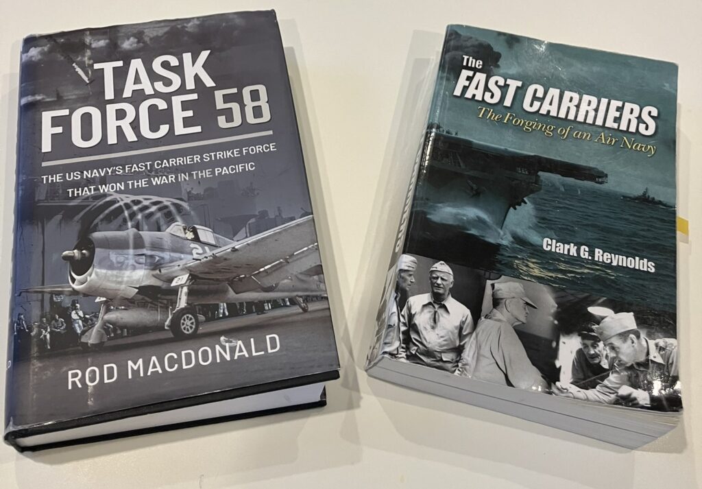 The covers of two books, on the left Task Force 58: The US Navy's Fast Carrier STrike Force That Won The War In The Pacific, by Rod Macdonald. On the right side, The Fast Carriers: The Forging of an Air Navy, by Clark G. Reynolds