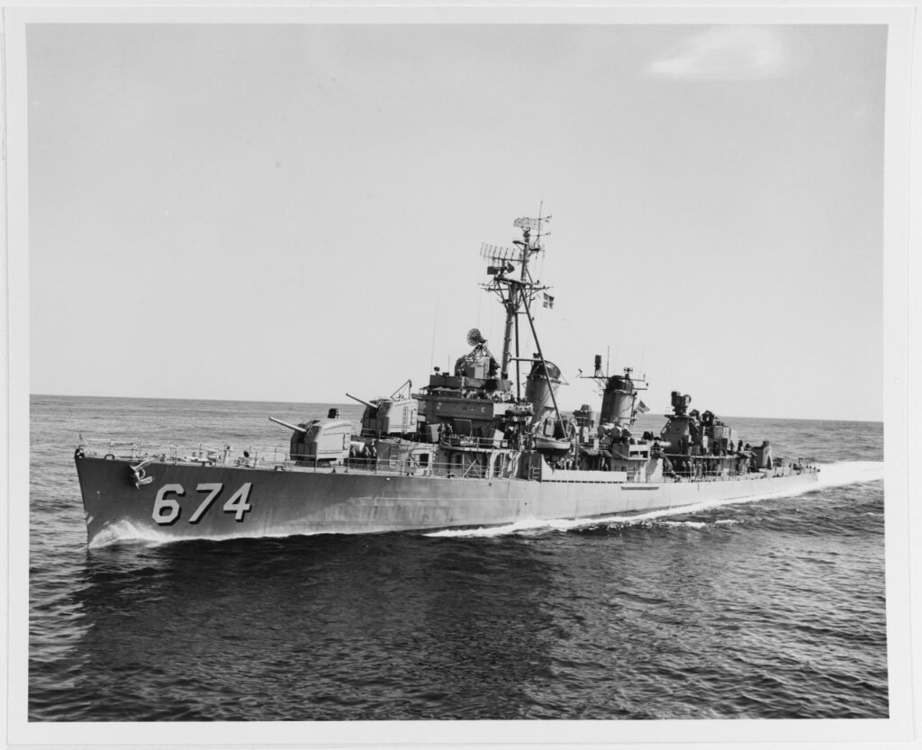 (DD-674) Coming alongside USS Tarawa (CVS-40) to refuel at sea, 25 April 1959. Official U.S. Navy Photograph, now in the collections of the National Archives. Catalog #: USN 1046540