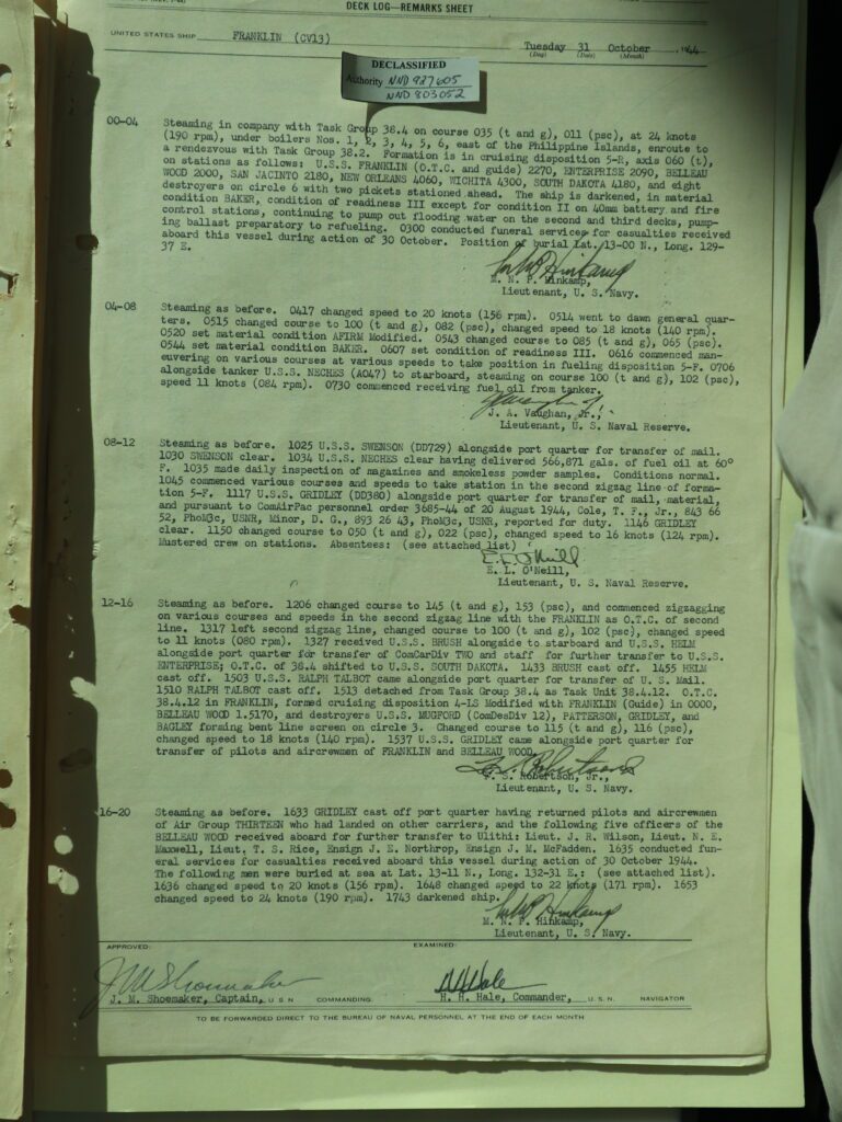 31 October deck log of USS Franklin. The day before she had been struck by a Kamikaze. This log details the burials at sea and her course back to Ulithi. (Author's photo of documents on file at US National Archives.)