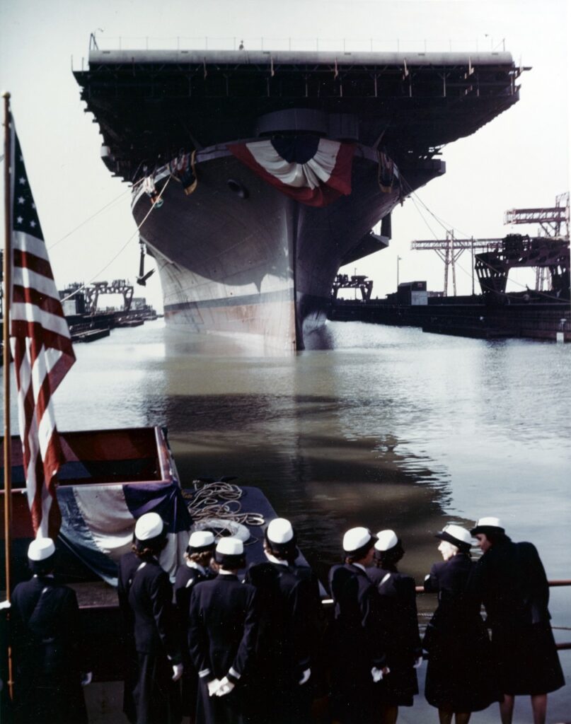 USS Franklin, with bunting draped underneath her bow, is floated out of dry dock on 14 October 1943. 