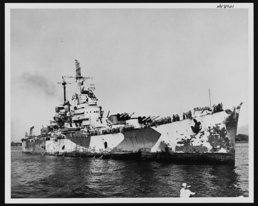 The cruiser, USS Birmingham, is shown with damage to her starboard hull caused when USS Princeton's magazine exploded while Birmingham was 50 feet away.
