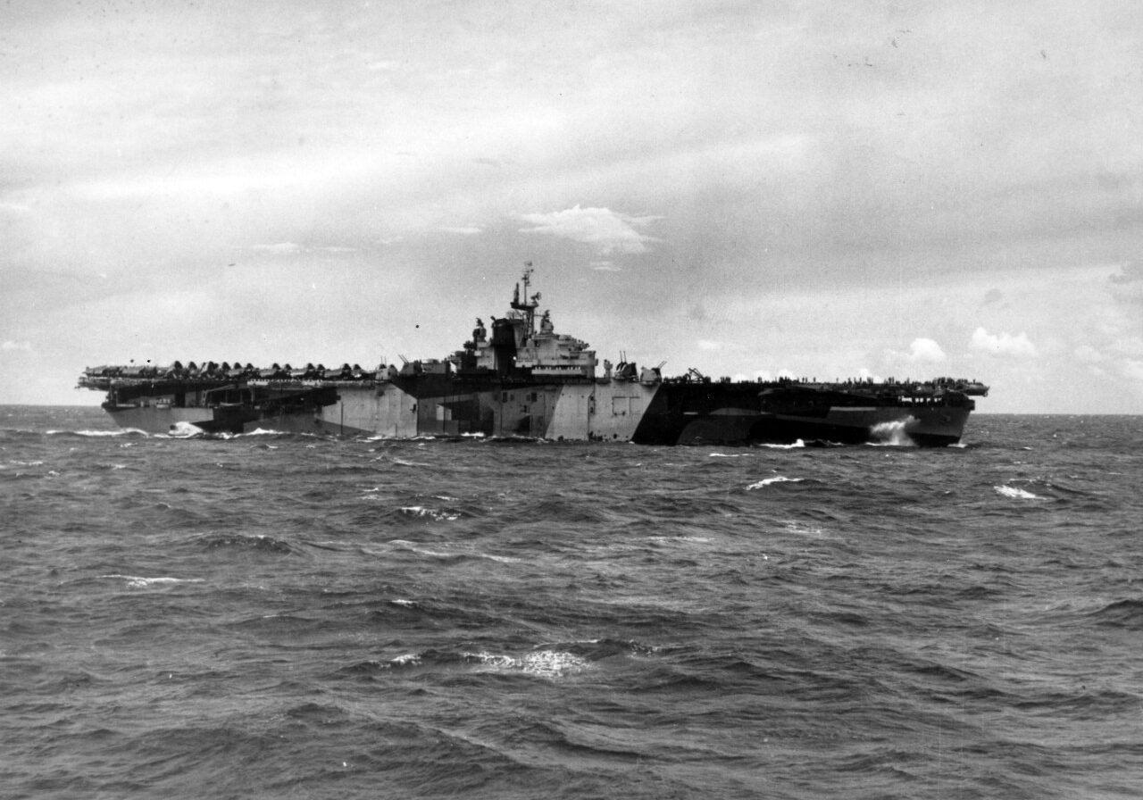 Operating near the Marianas, 1 August 1944. Photographed from USS Hornet (CV-12). Franklin is painted in camouflage Measure 32, Design 6a. At this time, Design 6a was applied only to her starboard side. She wore Design 3a on the port side. Official U.S. Navy Photograph, now in the collections of the National Archives. Catalog #: 80-G-367248