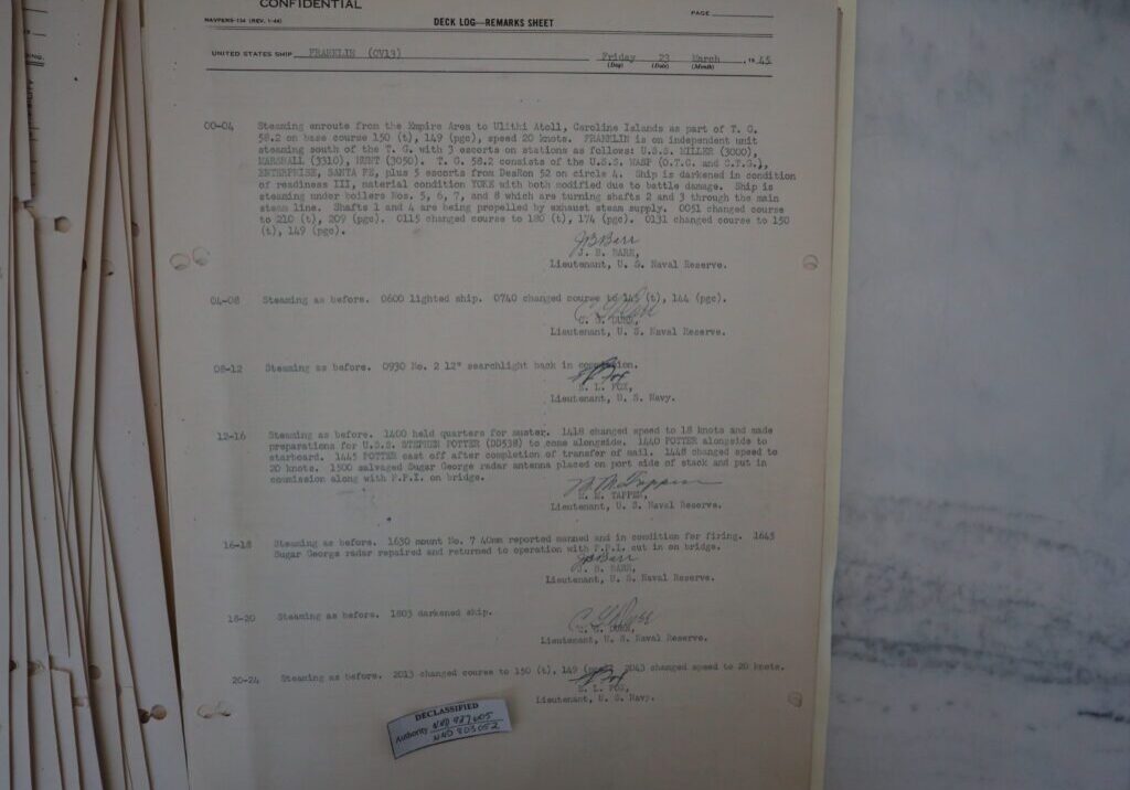 23 March 1945 deck log of USS FRANKLIN. It mentions the ship being accompanied by two other damaged carriers, WASP and ENTERPRISE along with escorts. Entries are brief compared to before the attack.