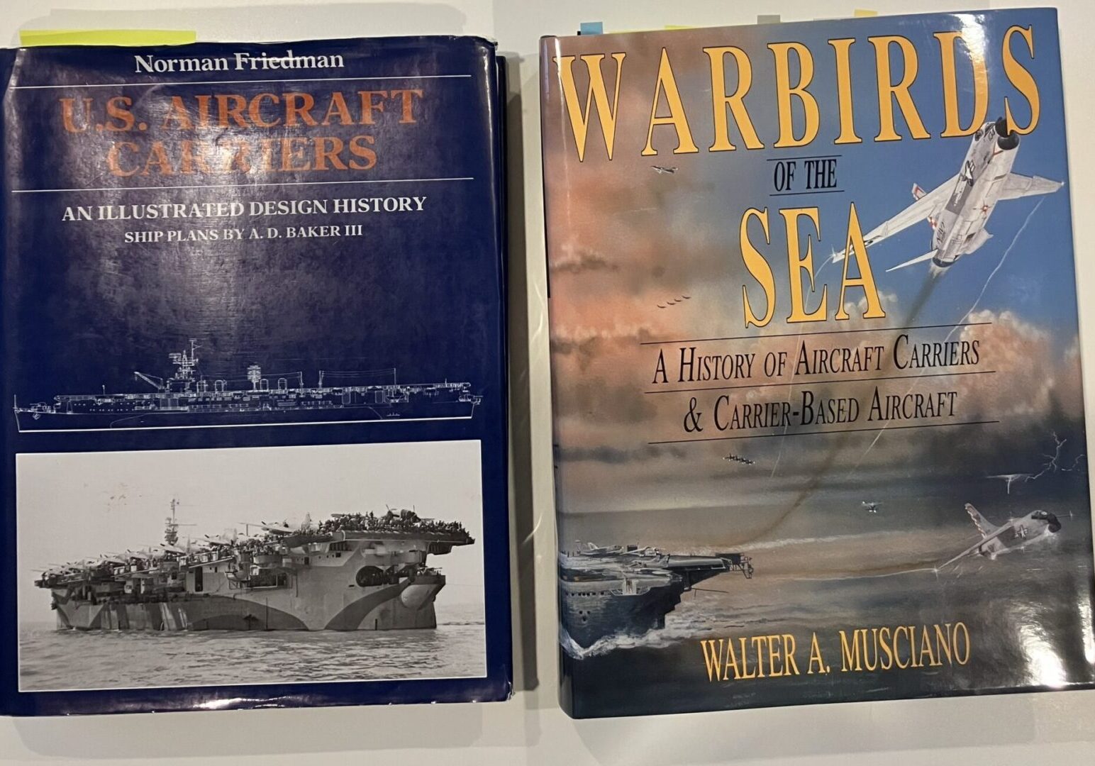 On the left, U.S. Aircraft CArriers: An Illustrated Design History by Norman Friedman. On the right, Warbirds of the Sea: A History of Aircraft Carriers & Carrier-Based Aircraft by Walter A Musciano