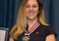 Citizen's Medal of Honor Awardee Molly Hudgens shown wearing the award around her neck.