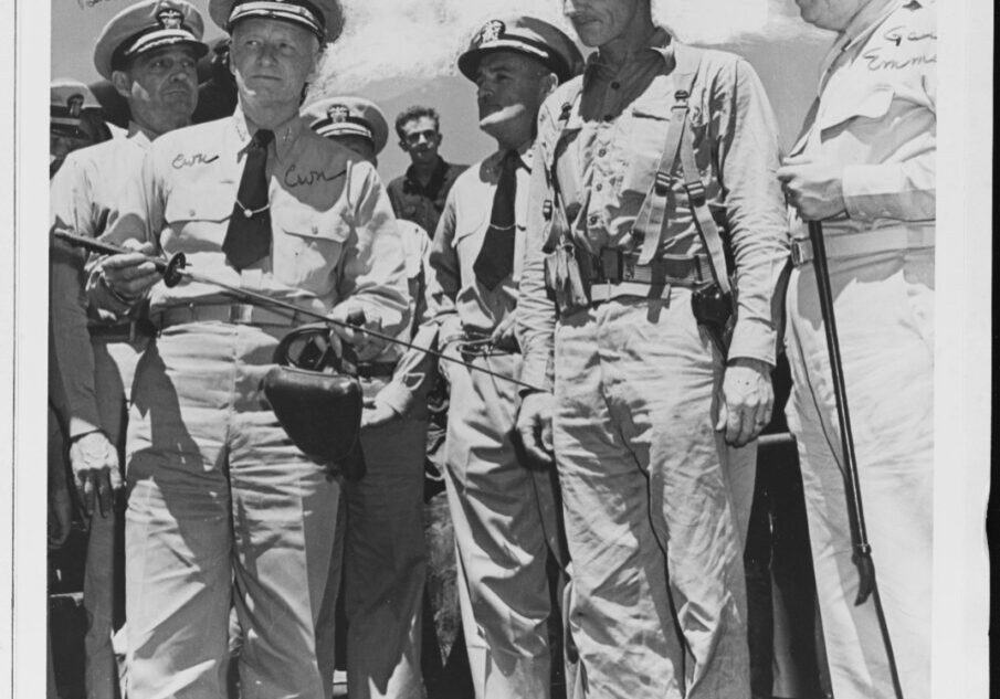 Admiral Nimitz visiting Guadalcanal shown holding a Samurai sword. The US Navy's ability to provide logistics was a key reason why the Japanese were defeated there.