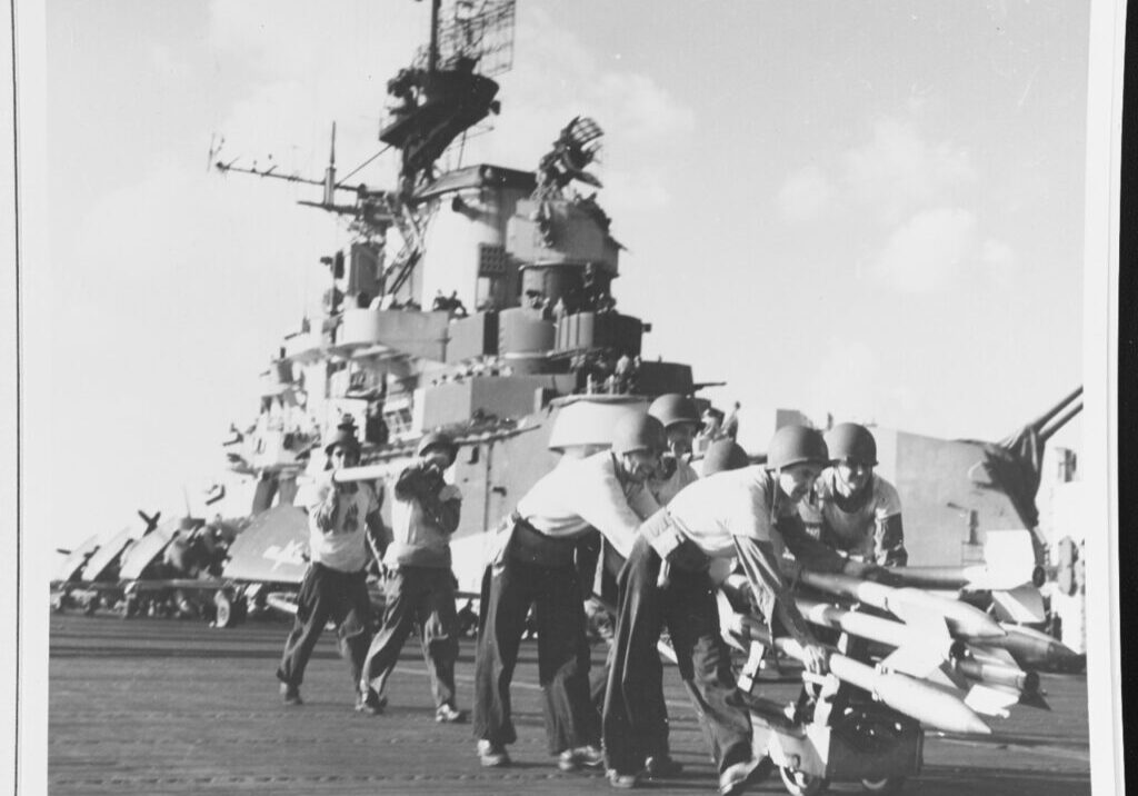 Crewmen on USS Hancock (CV-19) move 3.5-inch rockets (with 5-inch diameter warheads) to planes, while preparing for strikes on Formosa, 12 October 1944. Official U.S. Navy Photograph, now in the collections of the National Archives. Catalog #: 80-G-281338