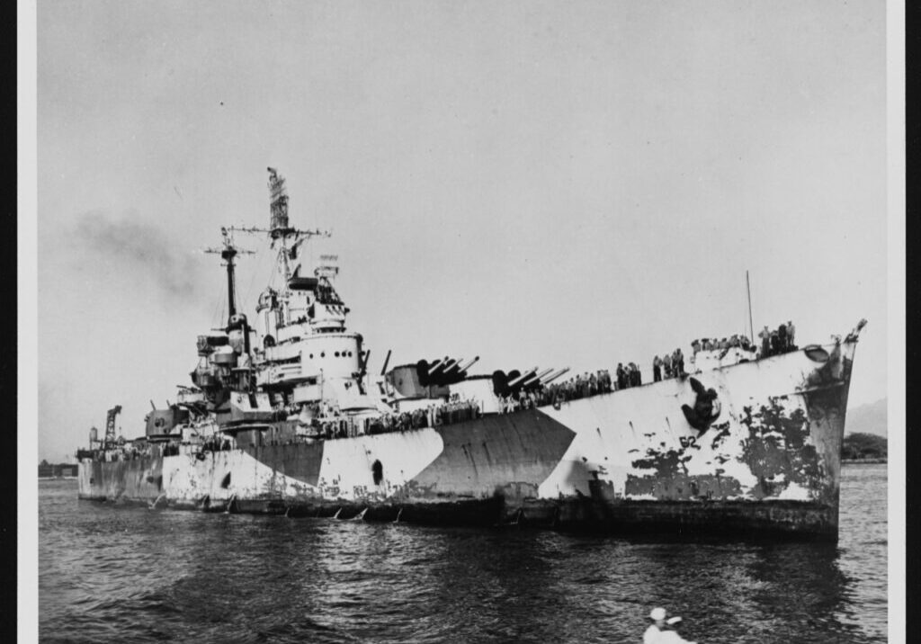 The cruiser, USS Birmingham, is shown with damage to her starboard hull caused when USS Princeton's magazine exploded while Birmingham was 50 feet away.